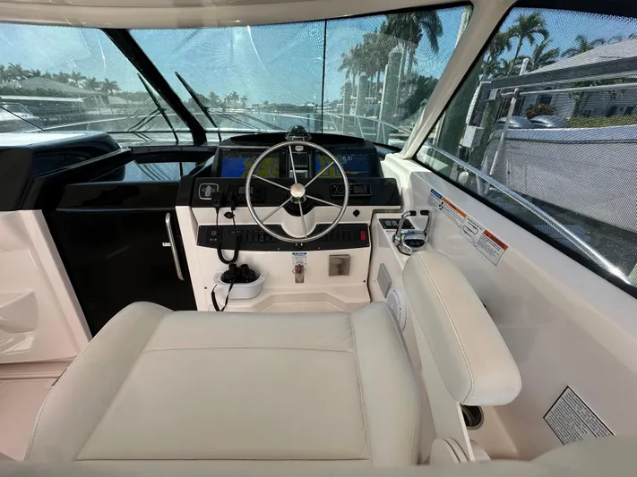  Yacht Photos Pics Helm of 2018 Tiara Yachts 4300 Open with modern controls and comfortable seating.