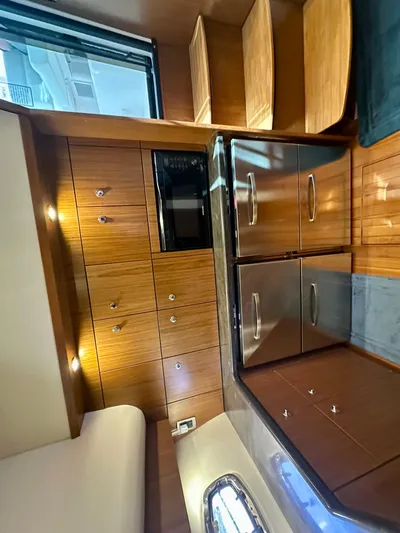  Yacht Photos Pics Interior of 2018 Tiara Yachts 4300 Open with wood cabinetry and stainless steel appliances.