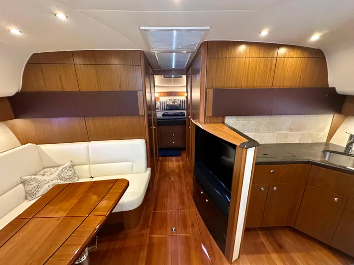  Yacht Photos Pics Luxurious interior of 2018 Tiara Yachts 4300 Open with wood finish and modern amenities.