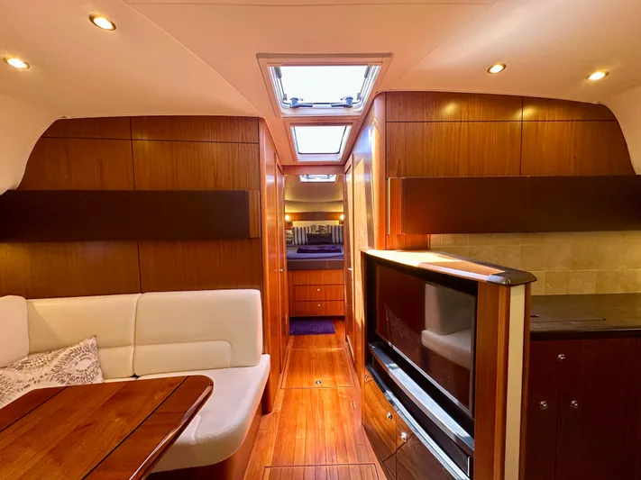  Yacht Photos Pics Luxurious interior of 2018 Tiara Yachts 4300 Open with wood finish and modern amenities.