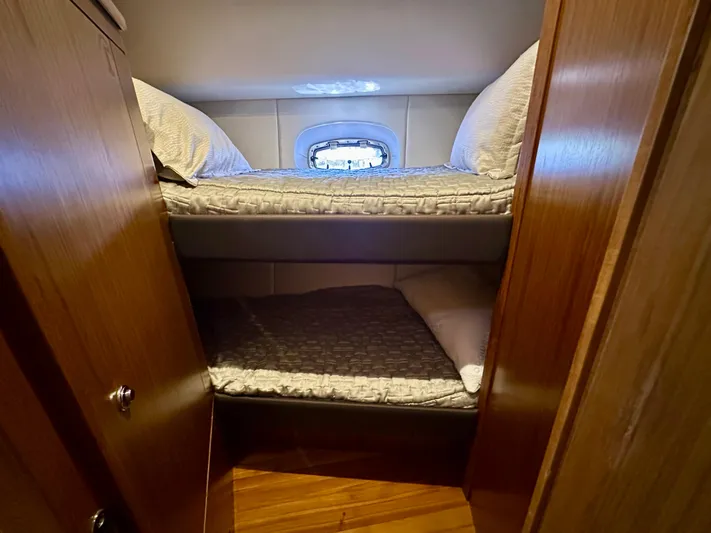  Yacht Photos Pics Bunk beds in 2018 Tiara Yachts 4300 Open cabin with wooden interior.
