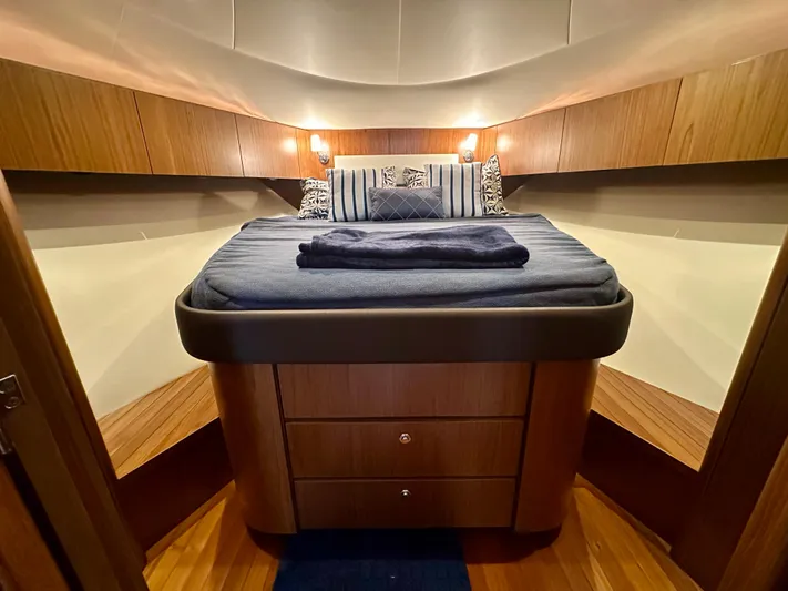  Yacht Photos Pics 2018 Tiara Yachts 4300 Open cabin with cozy bed and wooden interior.