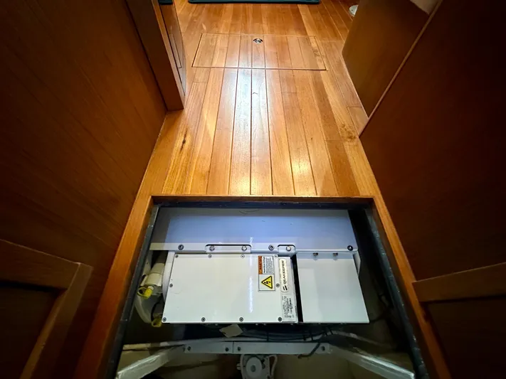  Yacht Photos Pics 2018 Tiara Yachts 4300 Open interior with wooden flooring and open hatch.