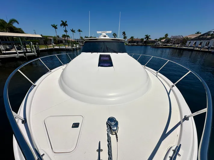  Yacht Photos Pics 2018 Tiara Yachts 4300 Open on calm water, showcasing sleek deck design.