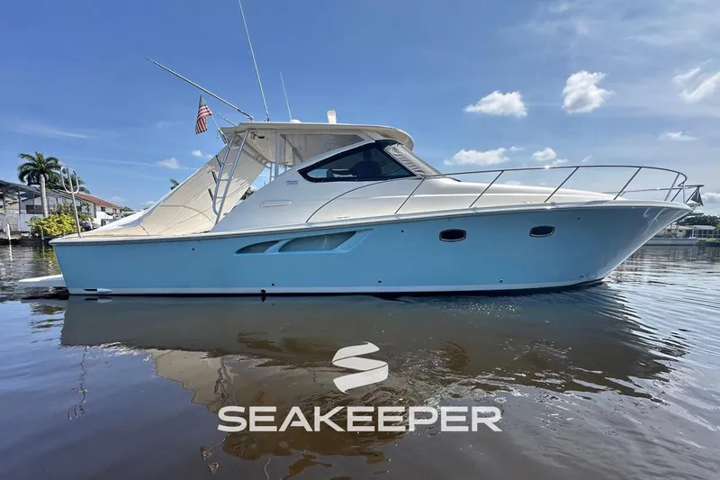  Yacht Photos Pics 2018 Tiara Yachts 4300 Open boat on calm water, featuring sleek design and Seakeeper logo.