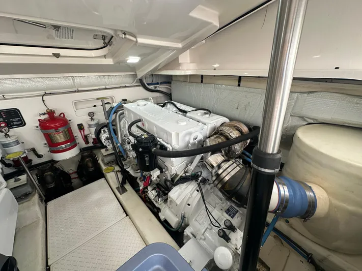  Yacht Photos Pics Engine room of 2018 Tiara Yachts 4300 Open, showcasing machinery and fire safety equipment.