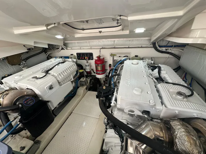  Yacht Photos Pics Engine room of 2018 Tiara Yachts 4300 Open, featuring dual engines and fire suppression system.