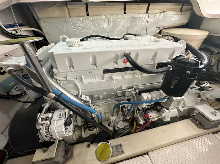  Yacht Photos Pics Engine room of a 2018 Tiara Yachts 4300 Open, showcasing a clean, well-maintained engine.