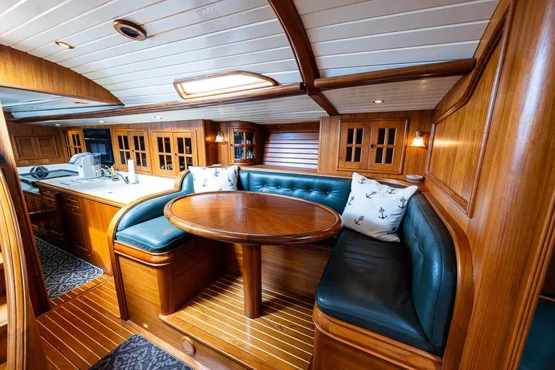 Koh -i -noor Yacht Photos Pics Luxurious 1974 C&C 61 Ocean Racer interior with wood finish and cozy seating area.