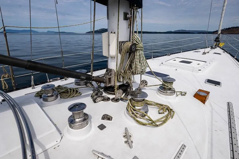 Koh -i -noor Yacht Photos Pics 1974 C&C 61 Ocean Racer/Cruiser deck with winches and ropes, sailing on calm waters.
