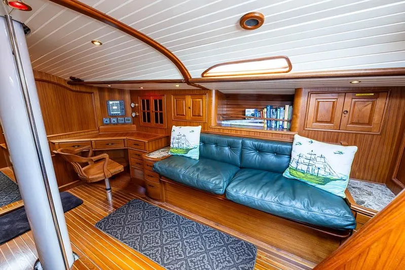 Koh -i -noor Yacht Photos Pics Luxurious 1974 C&C 61 Ocean Racer/Cruiser interior with wood paneling and blue leather seating.