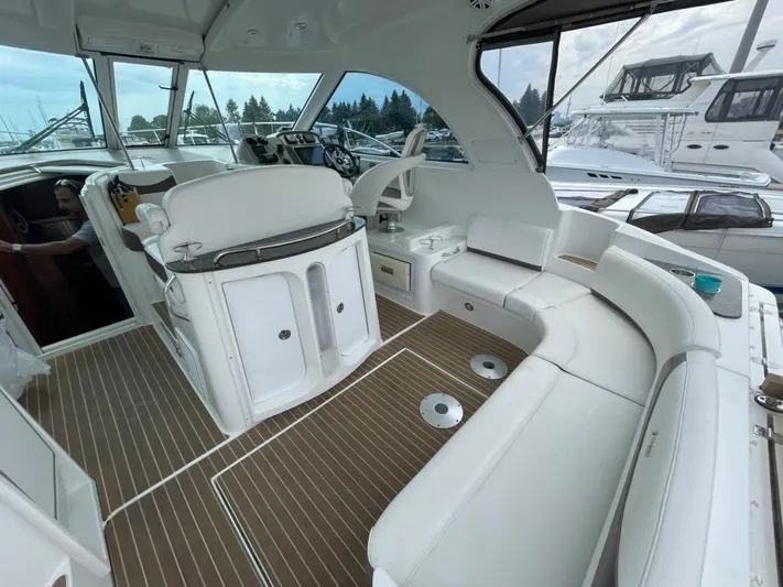 Yacht Photos Pics Interior of 2008 Cruisers 390 Sport Coupe with white seating and wood flooring.