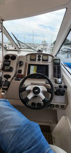  Yacht Photos Pics 2008 Cruisers 390 Sport Coupe helm with navigation controls and steering wheel.