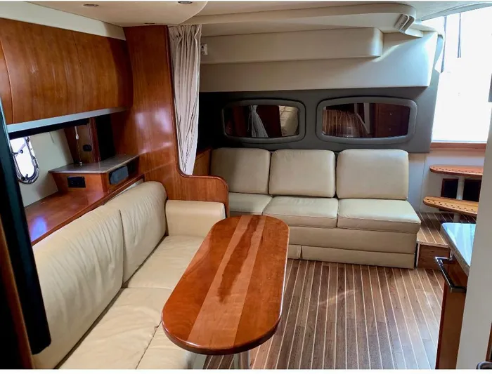  Yacht Photos Pics Interior of 2008 Cruisers 390 Sport Coupe with wood accents and beige seating.