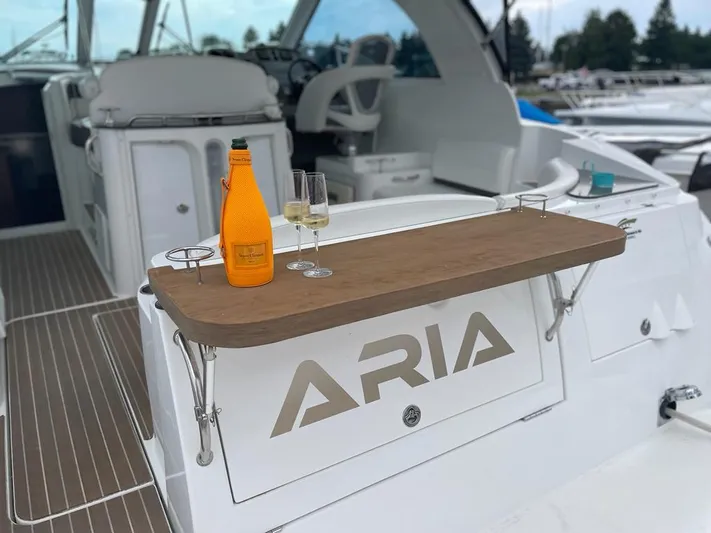  Yacht Photos Pics 2008 Cruisers 390 Sport Coupe yacht with drinks on deck, named "ARIA".