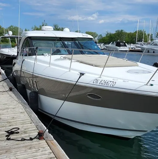  Yacht Photos Pics 2008 Cruisers 390 Sport Coupe docked at marina, surrounded by other boats.