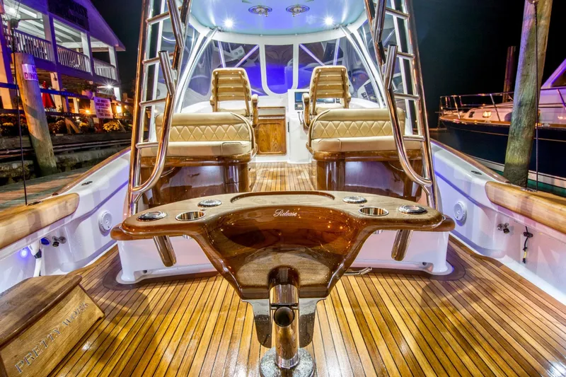 Southern Ground Yacht Photos Pics Luxurious 2015 Winter Custom Yachts W-18 with elegant wood finish and plush seating at night.