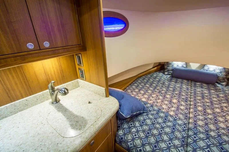 Southern Ground Yacht Photos Pics Luxurious 2015 Winter Custom Yachts W-18 cabin with cozy bed and elegant wood finish.