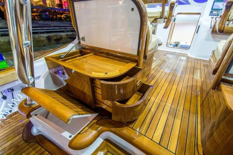 Southern Ground Yacht Photos Pics Luxurious 2015 Winter Custom Yachts W-18 interior with polished wooden finish and seating.