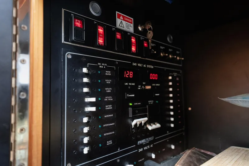 Southern Ground Yacht Photos Pics Electrical panel of 2015 Winter Custom Yachts W-18, showcasing switches and voltage indicators.