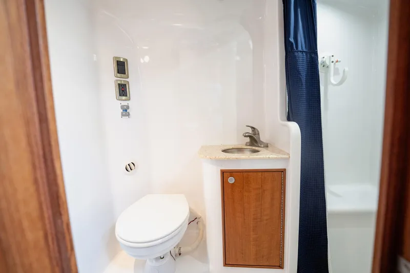 Southern Ground Yacht Photos Pics Luxurious bathroom in 2015 Winter Custom Yachts W-18, featuring modern fixtures and wood accents.