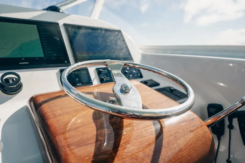 Southern Ground Yacht Photos Pics Steering wheel of 2015 Winter Custom Yachts W-18 with navigation screens.