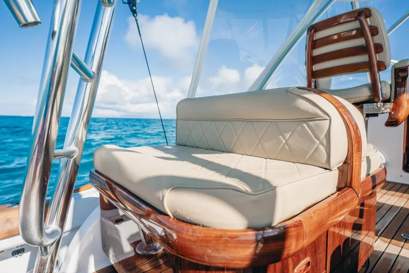 Southern Ground Yacht Photos Pics Luxurious seating on 2015 Winter Custom Yachts W-18, with ocean view and wooden accents.