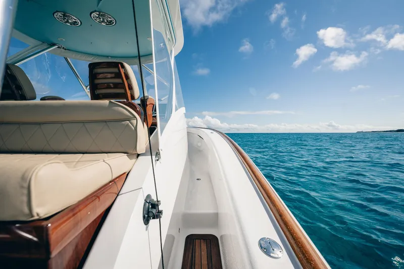 Southern Ground Yacht Photos Pics 2015 Winter Custom Yachts W-18 cruising on clear blue ocean under sunny sky.