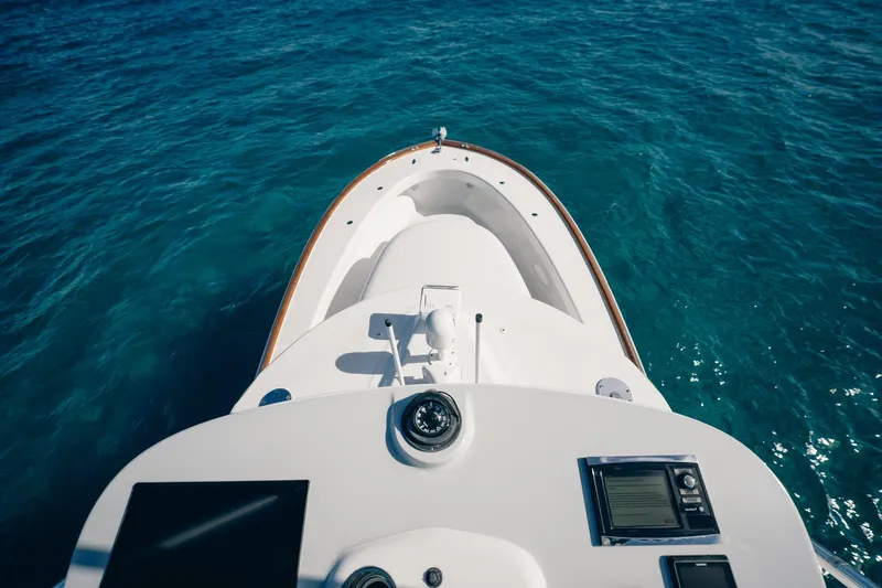 Southern Ground Yacht Photos Pics Bow view of 2015 Winter Custom Yachts W-18 on clear blue water.