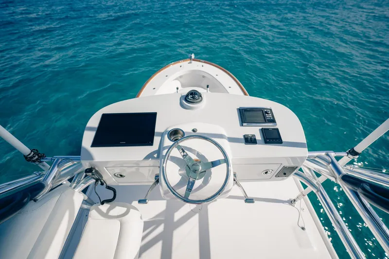 Southern Ground Yacht Photos Pics Steering console of 2015 Winter Custom Yachts W-18 on clear blue water.
