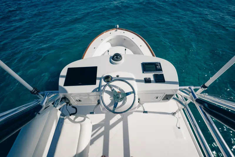 Southern Ground Yacht Photos Pics Helm of 2015 Winter Custom Yachts W-18 on clear blue water.