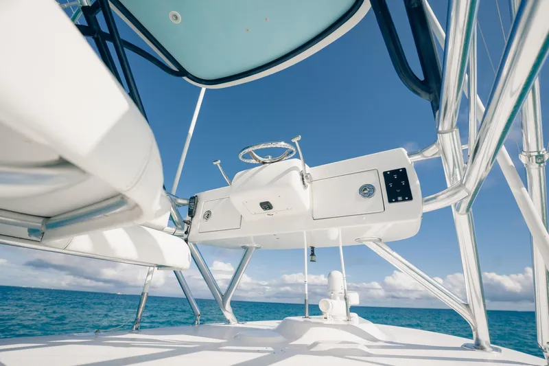 Southern Ground Yacht Photos Pics 2015 Winter Custom Yachts W-18 helm with ocean backdrop and clear sky.