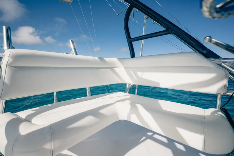 Southern Ground Yacht Photos Pics Luxurious seating on 2015 Winter Custom Yachts W-18, with ocean backdrop.