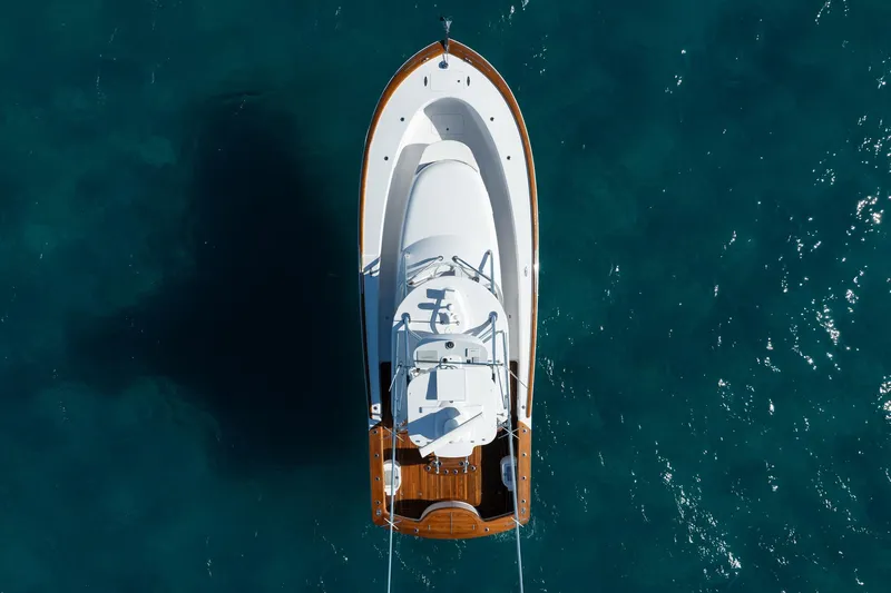 Southern Ground Yacht Photos Pics Overhead view of 2015 Winter Custom Yachts W-18 on clear blue water.