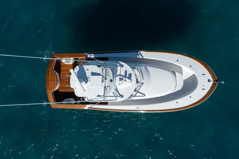 Southern Ground Yacht Photos Pics Overhead view of 2015 Winter Custom Yachts W-18 on clear blue water.