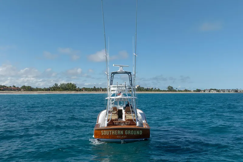 Southern Ground Yacht Photos Pics 2015 Winter Custom Yachts W-18 boat on blue ocean near coastline.