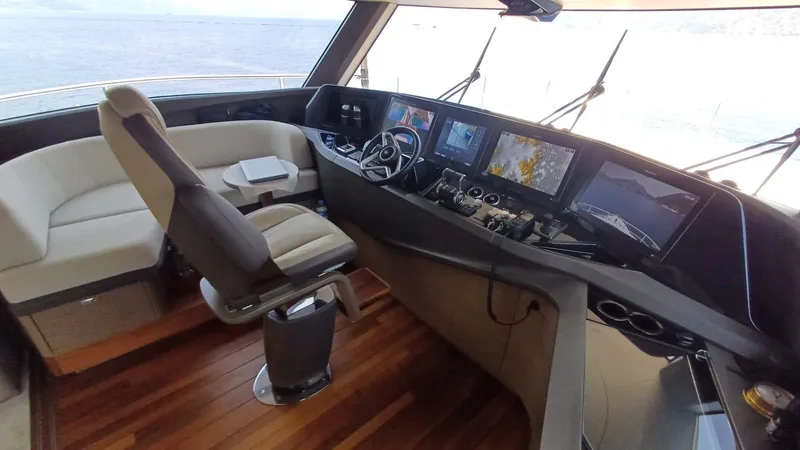  Yacht Photos Pics Luxurious 2024 Princess X80 yacht cockpit with advanced navigation systems and plush seating.