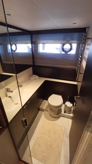  Yacht Photos Pics Luxurious bathroom in 2024 Princess X80 yacht with modern fixtures and elegant design.