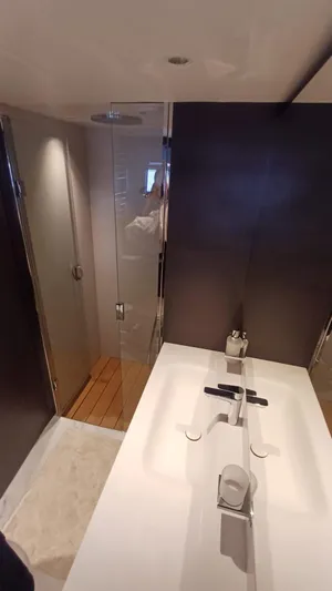  Yacht Photos Pics Luxurious bathroom in 2024 Princess X80 yacht with modern fixtures and sleek design.