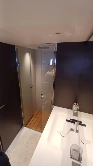  Yacht Photos Pics Luxurious bathroom in 2024 Princess X80 yacht with modern fixtures and sleek design.