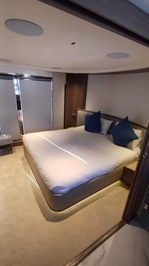  Yacht Photos Pics Luxurious bedroom interior of 2024 Princess X80 yacht with modern design and elegant furnishings.