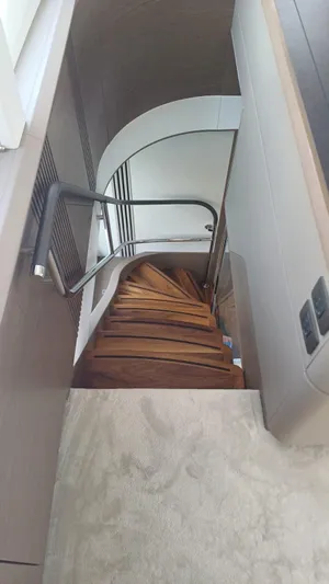  Yacht Photos Pics Elegant wooden staircase in 2024 Princess X80 yacht interior.