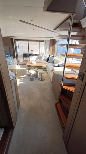  Yacht Photos Pics Luxurious interior of 2024 Princess X80 yacht with modern seating and elegant staircase.
