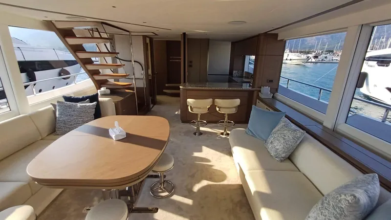  Yacht Photos Pics Luxurious interior of 2024 Princess X80 yacht with elegant seating and scenic marina views.