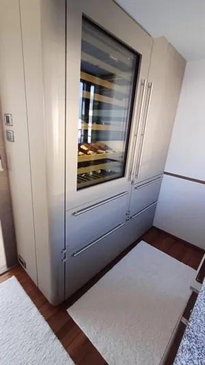  Yacht Photos Pics Modern kitchen with sleek cabinetry and built-in wine cooler on Princess X80 yacht, 2024 model.