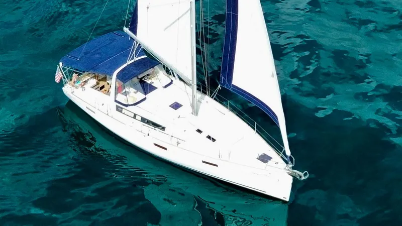 “imagine That” Yacht Photos Pics 2015 Beneteau Oceanis 45 sailing on clear blue water.