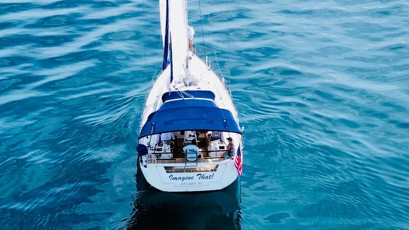 “imagine That” Yacht Photos Pics Beneteau Oceanis 45 sailboat on calm blue water, aerial view, 2015 model.