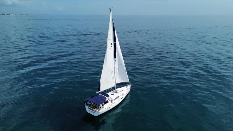 “imagine That” Yacht Photos Pics Sailing yacht Beneteau Oceanis 45, 2015 model, cruising on calm blue waters.
