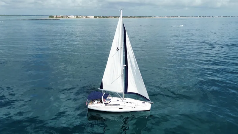 “imagine That” Yacht Photos Pics Sailing yacht Beneteau Oceanis 45, 2015 model, cruising on calm blue waters.