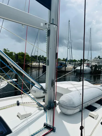 “imagine That” Yacht Photos Pics 2015 Beneteau Oceanis 45 sailboat docked, featuring mast and rigging, with cloudy sky backdrop.